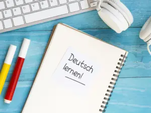 top-view-studying-new-language-tools-blue-wooden-background-_1_